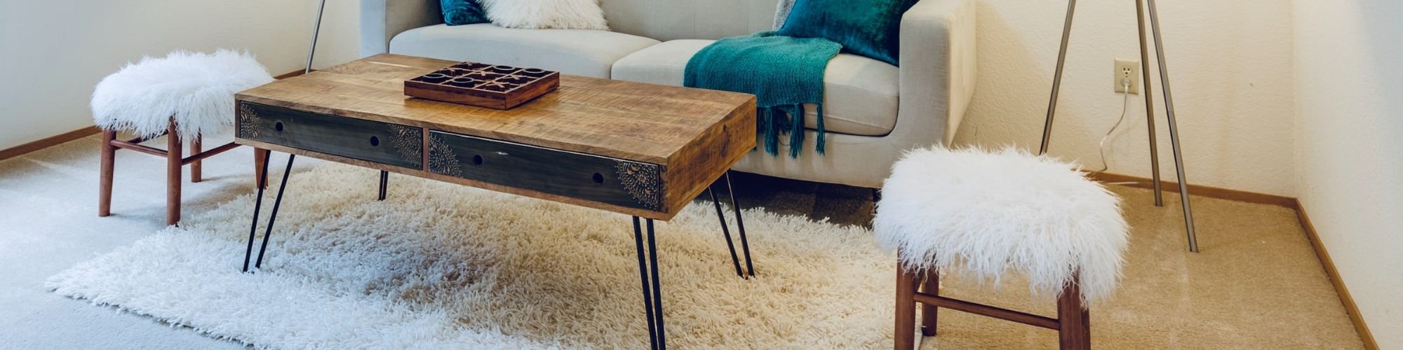 white couch and brown coffee table on a brown hardwood floor Johnson & Sons Flooring in Knoxville, TN